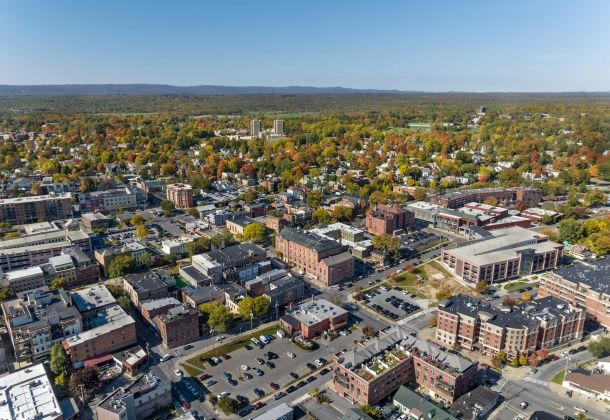 Aerial view of Saratoga Springs featuring tall buildings and trees.